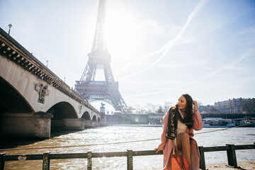 Beautiful girl on background of the Eiffel tower