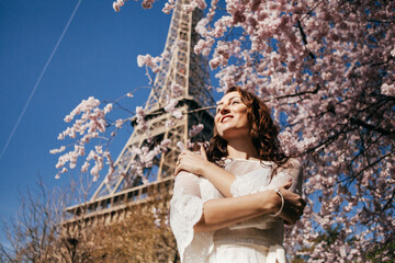 Beautiful girl on background of the Eiffel tower