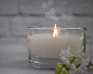 aroma candle flower lilac in the apartment