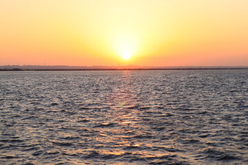 Beautiful Sunset Over The Tropical Sea or Sunset over the arabian Sea. Bright Orange Sun Setting on Beautiful Blue Water. located in Diu district of Union Territory Daman and Diu India