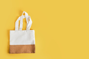 shopper bag on a yellow background, bag made of natural materials, fabric and cork leather,...