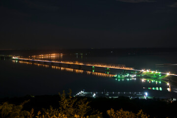 Fototapeta premium Imperial bridge on the Volga river, a picture at night on a long shutter speed. Ulyanovsk, Russia