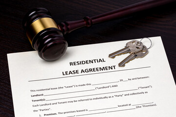 Residential lease agreement contract and gavel. Real estate law and rental dispute concept.