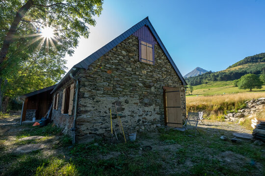 Authentic renovated Pyrenean barn in the Aure valley. slate roof, exposed stone and wood construction. amazing view on the mountains