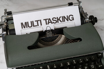 Multi tasking written on a paper in a type writer