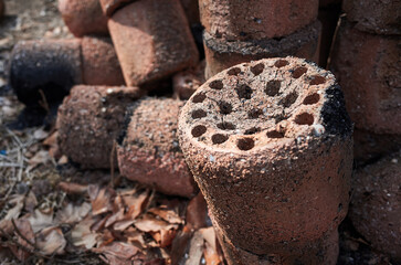 Briquettes used and abandoned in the empty lot.
