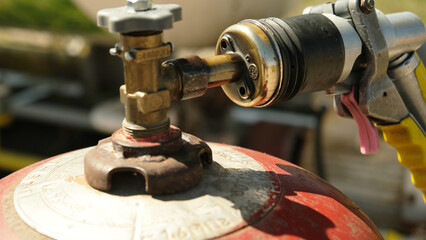 Filling the gas cylinder with gas. Gas cylinder for cooking.