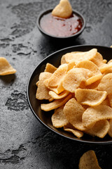 Crispy Prawn Crackers in black bowl with sweet chilli sauce
