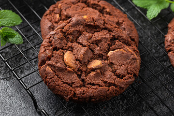 Chocolate, orange chip cookies on cooling rack