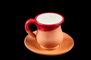 Traditional Turkish Dibek coffee in coffee cup on wooden table. Turkish dibek coffee grinded in a...