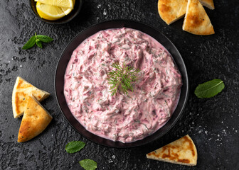 Greek Beetroot cucumber tzatziki dip sauce with flat bread