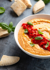 Roasted red pepper hummus with pita bread. Healthy food