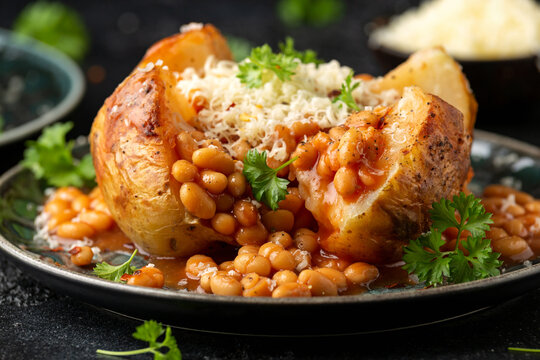 Jacket Baked potato with tomato beans, cheddar cheese. Traditional British food