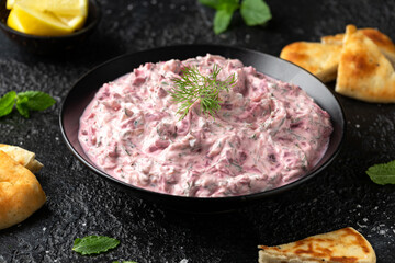 Greek Beetroot cucumber tzatziki dip sauce with flat bread