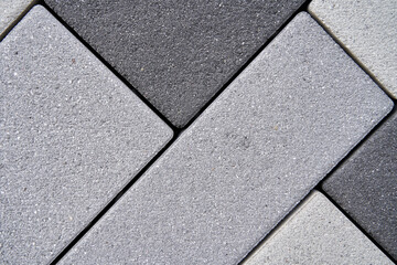 Rectangular blocks of stone diagonally in different shades. Can be used as background, wall or floor. Bricks in light to dark. Empty area for text.