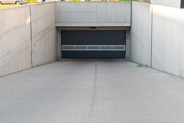 Entrance gate to the underground garage on residential area