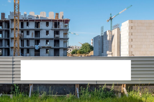 Blank white banner for advertisement on a fence of construction site
