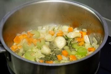 Vegetarian casserole ratatouille, baked in a frying pan on a light background, top view