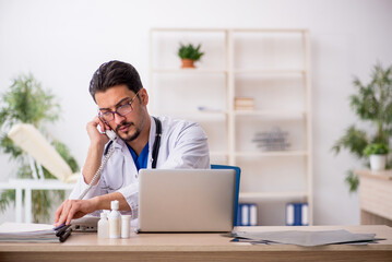 Young male doctor in telemedicine concept