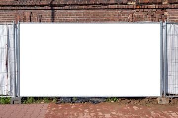 Blank white banner for advertisement mounted on the hoarding of construction site in front of old...