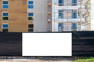 Blank white banner for advertisement on the fence of construciton site