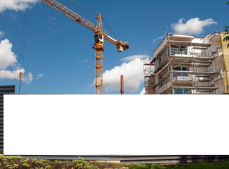 Blank white banner for advertisement on the fence of construciton site © diesirae