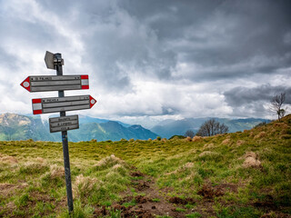 Trail signs in the alps of Lake Como