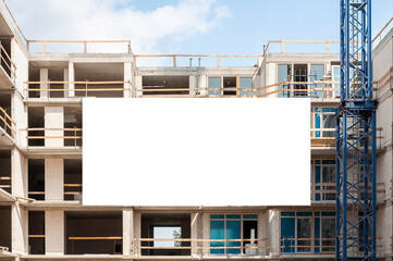 Blank white banner for advertisement on the facade of building under construction