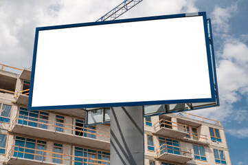 Blank white advertising billboard on the construction site