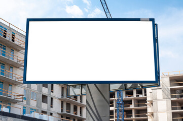 Blank white advertising billboard on the construction site