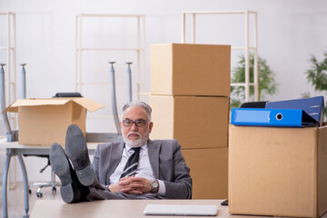 Old male employee in relocation concept