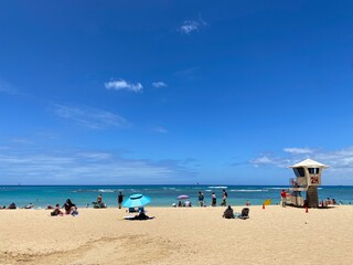 Fototapeta na wymiar Hawaii beach scene, breezy hot May summer Waikiki Oahu island, year 2022