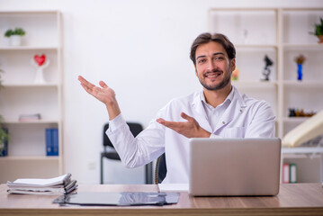 Young male doctor working in the clinic