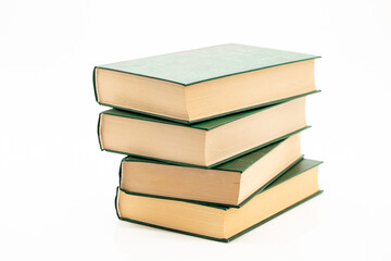 Reading and education. Books stack with green covers on a white background.Reading of books. Knowledge concept.Literature and reading concept. 