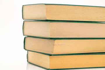  Books stack with green covers on a white background.Reading of books. Knowledge and education. Literature and reading concept. 
