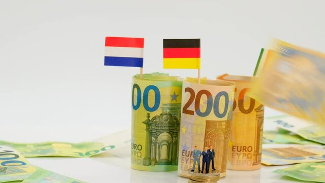 Budgets and finances of the EU countries. Politicians and businessmen of European countries.state of the economy in Germany, France and Italy concept. Figures of men in suits on euro coins 