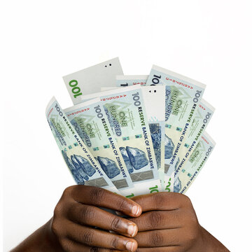 Black hands holding 3D rendered 100 Zimbabwean dollar notes. closeup of Hands holding Zimbabwean currency notes