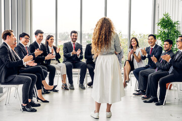 Obraz premium Businesswoman coach speaker presentation and discussing meeting strategy sharing idea.Creative team business people seminar and brainstorm in conference seminar at hall.presentation and teamwork
