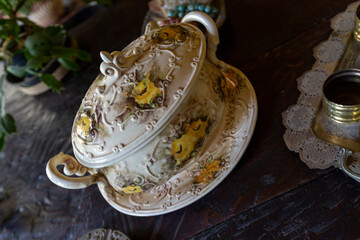 old porcelain tureen with patterned flowers