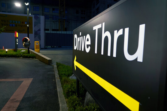 BUSAN, SOUTH KOREA - CIRCA MAY, 2017: Drive Thru sign at McDonald's. A drive-thru is a type of service provided by a business that allows customers to purchase products without leaving their cars.