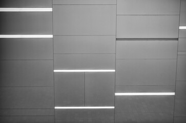 Silver Gray Glass Wall with Rectangular Fluorescent Lights.