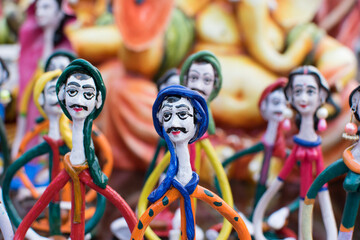 Colorful dolls made of clay, handicrafts on display during the Handicraft Fair in Kolkata , earlier...