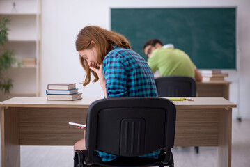 Two students sitting in the classroom