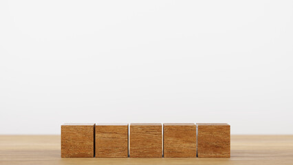Row of 5 wooden cube block for put alphabet on wood table, 3D rendering.