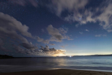 Fototapeta na wymiar The night sky at the beach