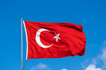 Turkish flag waving in the blue sky, flagpole, 