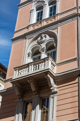 The facade of a building in the historic center of Trieste, Italy.