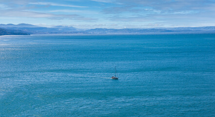 The yacht is on the emerald Adriatic Sea near Duino, Gulf of Trieste, Italy.Breeze