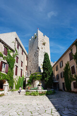 Fototapeta na wymiar Courtyard of the Gothic Duino Castle on a cliff above the Gulf of Trieste (Adriatic Sea), Italy