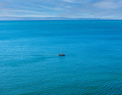 The yacht is on the emerald Adriatic Sea near Duino, Gulf of Trieste, Italy.Breeze